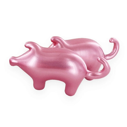 Perles de bain hydratantes en forme de petits cochons roses. Un soin ludique à l'huile de soja et au parfum de Rose de Grasse, fabriqué en France par la boutique KAVERN.